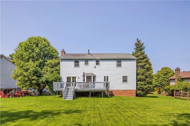 116 Rizzi Dr, Penn Twp Wml, PA 15642 - rear view of property with a deck, a chimney, and a yard