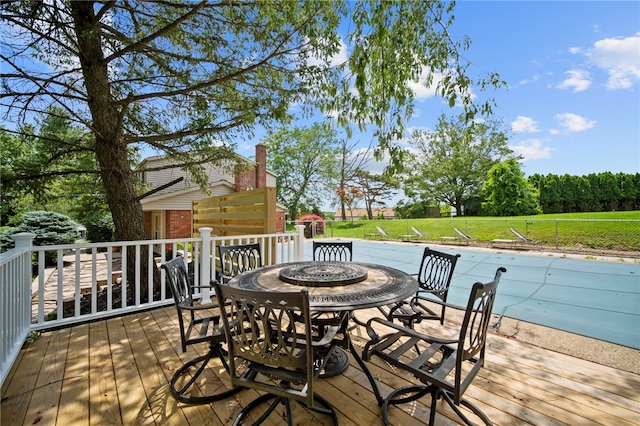 1202 Oakridge Rd, South Fayette, PA 15057 - wooden terrace featuring outdoor dining area, a pool, and a yard