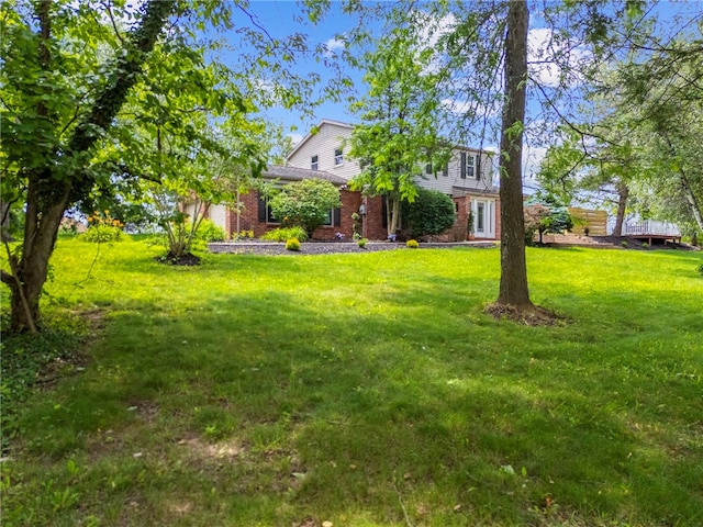 1202 Oakridge Rd, South Fayette, PA 15057 - view of front of home with brick siding, a front yard, and an attached garage
