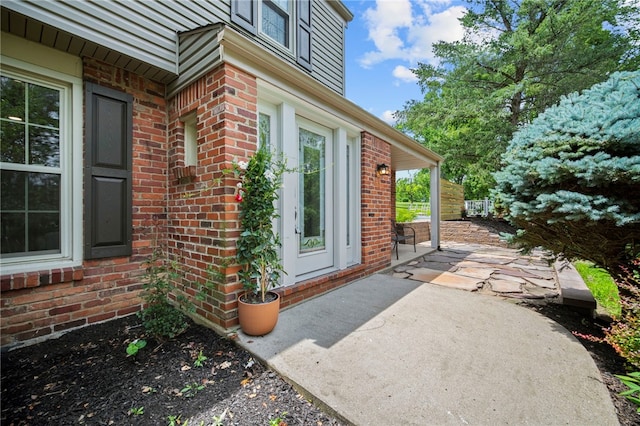 1202 Oakridge Rd, South Fayette, PA 15057 - property entrance with brick siding and a patio