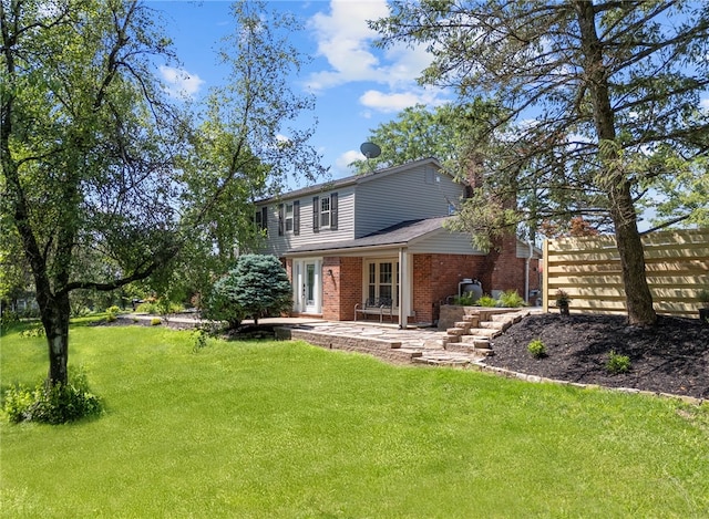 1202 Oakridge Rd, South Fayette, PA 15057 - back of property with brick siding and a patio area