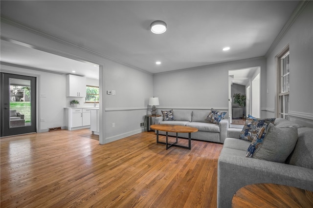 1202 Oakridge Rd, South Fayette, PA 15057 - living room featuring crown molding, light wood-type flooring, and recessed lighting