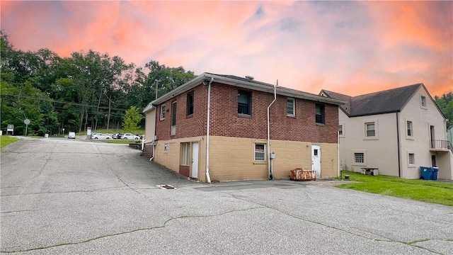 408 Rodi Rd, Penn Hills, PA 15235 - back of property at dusk featuring brick siding