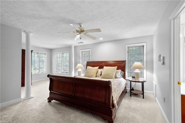 1648 Blackburn Heights Dr, Ohio Twp, PA 15143 - bedroom with light colored carpet, decorative columns, a textured ceiling, and ceiling fan