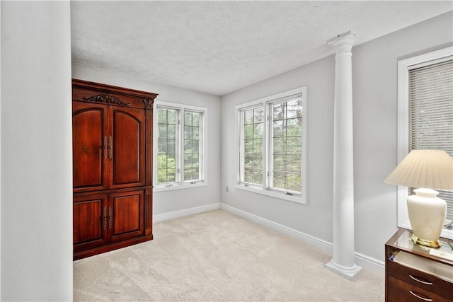 1648 Blackburn Heights Dr, Ohio Twp, PA 15143 - bedroom featuring ornate columns, light carpet, and a textured ceiling