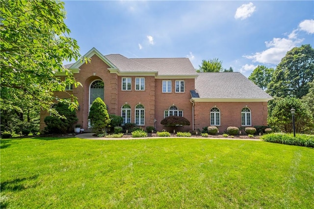 1648 Blackburn Heights Dr, Ohio Twp, PA 15143 - colonial-style house with a front lawn, brick siding, and roof with shingles