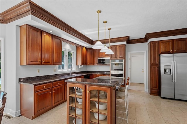 1648 Blackburn Heights Dr, Ohio Twp, PA 15143 - kitchen with appliances with stainless steel finishes, ornamental molding, decorative light fixtures, glass insert cabinets, and a center island