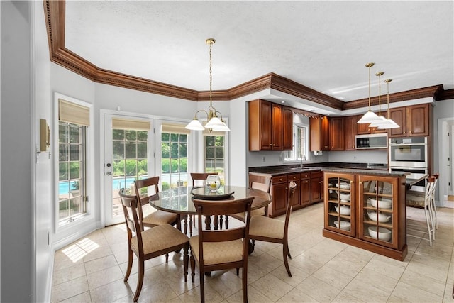 1648 Blackburn Heights Dr, Ohio Twp, PA 15143 - dining space with ornamental molding, healthy amount of natural light, light tile patterned floors, and a textured ceiling