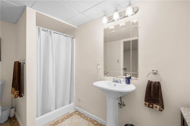 1648 Blackburn Heights Dr, Ohio Twp, PA 15143 - bathroom with a shower with curtain, a drop ceiling, and tile patterned floors