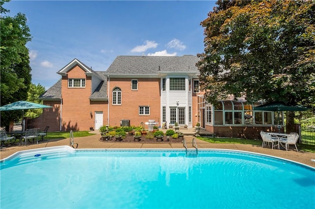 1648 Blackburn Heights Dr, Ohio Twp, PA 15143 - outdoor pool featuring a patio area, a sunroom, and outdoor dining area