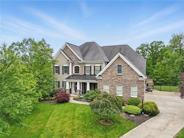 322 Dirkshire Ct, Adams Twp, PA 16046 - view of front facade featuring stone siding, a porch, a standing seam roof, and concrete driveway