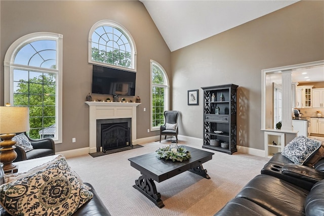 322 Dirkshire Ct, Adams Twp, PA 16046 - living room with high vaulted ceiling, healthy amount of natural light, light carpet, and a fireplace with flush hearth