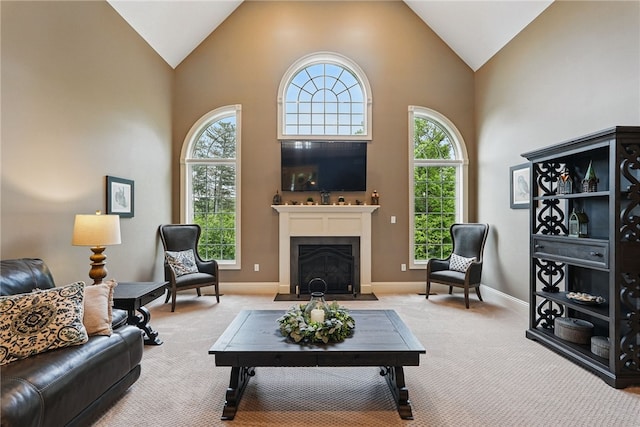 322 Dirkshire Ct, Adams Twp, PA 16046 - living area featuring carpet flooring, healthy amount of natural light, a fireplace with flush hearth, and high vaulted ceiling