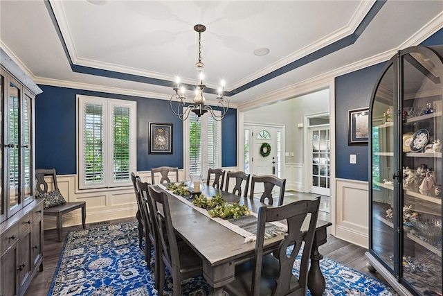 322 Dirkshire Ct, Adams Twp, PA 16046 - dining room featuring a raised ceiling, wainscoting, a decorative wall, dark wood-style floors, and a chandelier