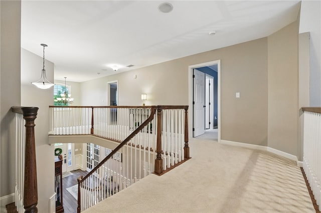 322 Dirkshire Ct, Adams Twp, PA 16046 - hallway with an upstairs landing, a chandelier, and carpet