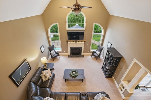 322 Dirkshire Ct, Adams Twp, PA 16046 - carpeted living area with a ceiling fan, high vaulted ceiling, and a fireplace with raised hearth