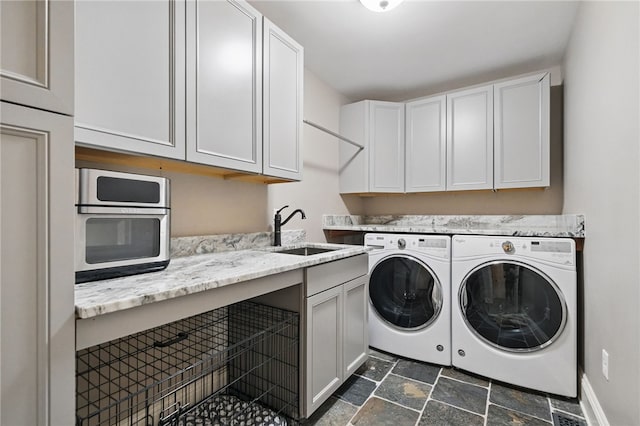 322 Dirkshire Ct, Adams Twp, PA 16046 - laundry room featuring separate washer and dryer, dark stone finish flooring, and cabinet space