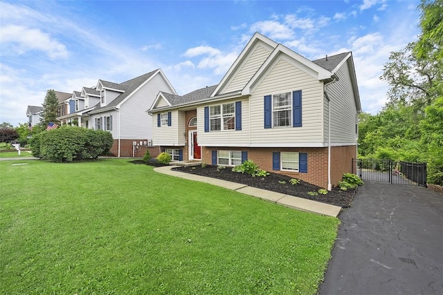 196 Oakbrook Cir, Banksville/Westwood, PA 15220 - raised ranch featuring a gate, brick siding, and asphalt driveway