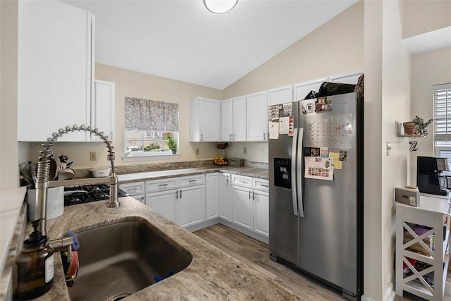 196 Oakbrook Cir, Banksville/Westwood, PA 15220 - kitchen featuring stainless steel fridge, light wood-type flooring, vaulted ceiling, white cabinetry, and healthy amount of natural light