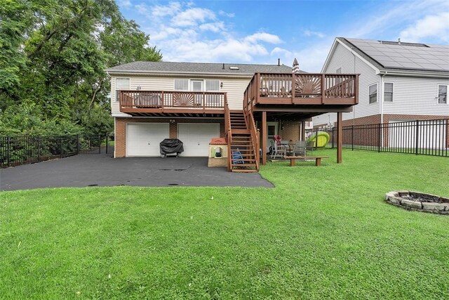 196 Oakbrook Cir, Banksville/Westwood, PA 15220 - back of house with a deck, an outdoor fire pit, a fenced backyard, and brick siding