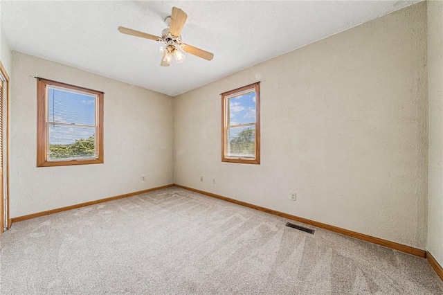 585 Dugan Way, New Kensington, PA 15068 - carpeted empty room featuring plenty of natural light and a ceiling fan