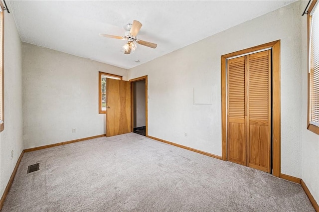 585 Dugan Way, New Kensington, PA 15068 - unfurnished bedroom with carpet flooring, a closet, and a ceiling fan