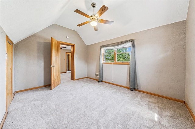 585 Dugan Way, New Kensington, PA 15068 - empty room with lofted ceiling, a ceiling fan, carpet flooring, and a textured wall
