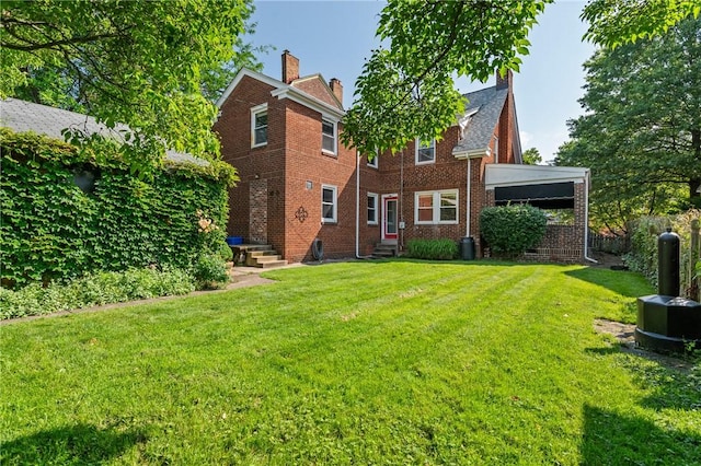 1216 Laclair Ave, Regent Square, PA 15218 - back of property featuring entry steps, a chimney, brick siding, and a lawn