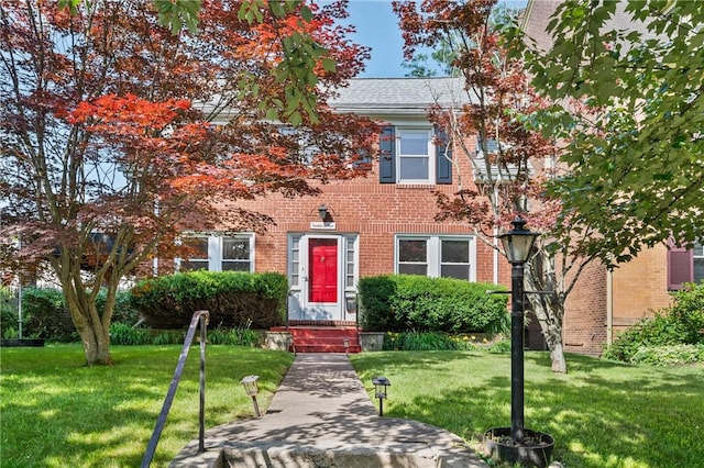 1216 Laclair Ave, Regent Square, PA 15218 - view of front of home featuring brick siding and a front yard