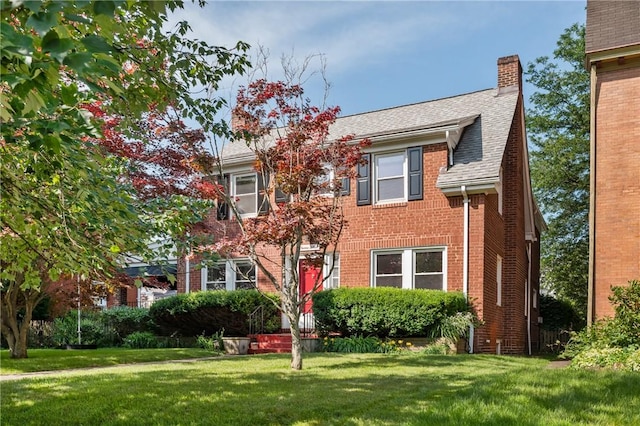 1216 Laclair Ave, Regent Square, PA 15218 - view of front of property featuring brick siding, a front yard, a chimney, and roof with shingles