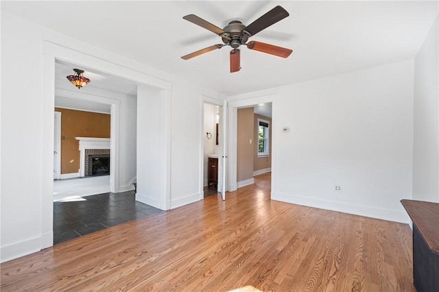 1216 Laclair Ave, Regent Square, PA 15218 - spare room with ceiling fan, a fireplace, and wood finished floors
