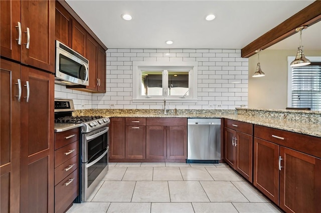 1216 Laclair Ave, Regent Square, PA 15218 - kitchen with stainless steel appliances, decorative backsplash, recessed lighting, light tile patterned floors, and light stone countertops