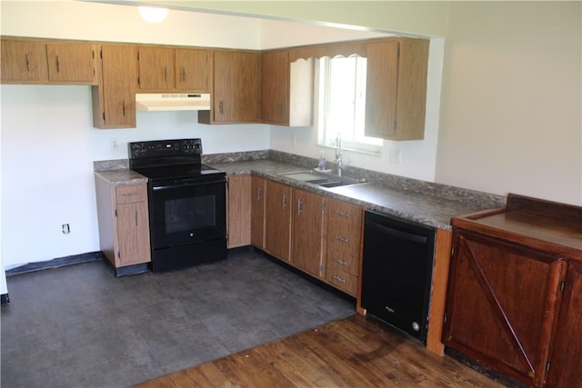 125 Clay St, Marion Twp, PA 16020 - kitchen featuring black appliances, under cabinet range hood, dark countertops, dark wood-type flooring, and brown cabinets
