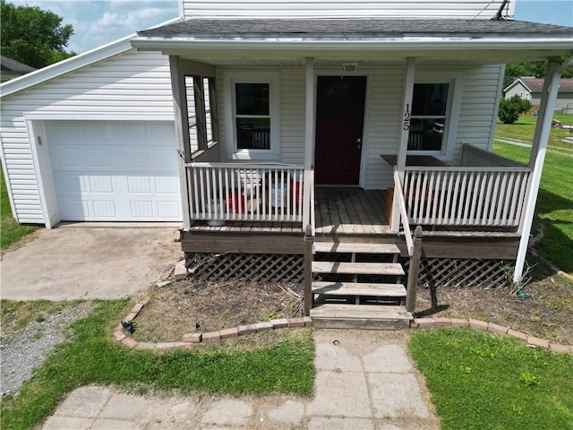125 Clay St, Marion Twp, PA 16020 - view of front of property featuring a porch, a shingled roof, and a garage