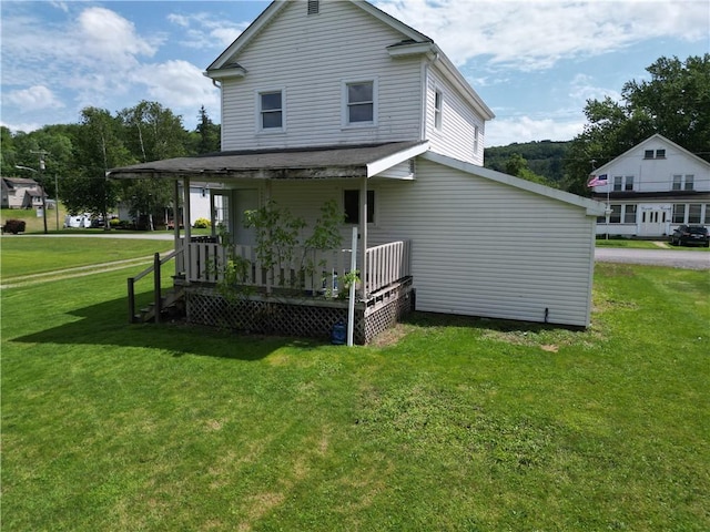125 Clay St, Marion Twp, PA 16020 - back of house featuring a porch and a lawn