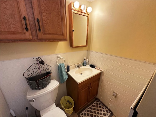 206 Pine St, Connellsville, PA 15425 - bathroom featuring vanity, tile walls, and wainscoting