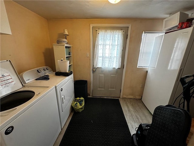 206 Pine St, Connellsville, PA 15425 - laundry area featuring separate washer and dryer and light wood finished floors