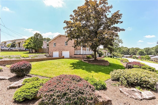 25 Nottingham Dr, Hempfield Twp, PA 15601 - view of side of home with a garage, a yard, a residential view, and brick siding