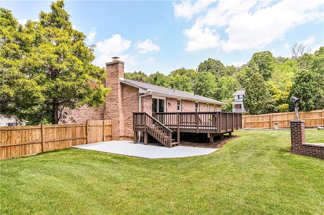 25 Nottingham Dr, Hempfield Twp, PA 15601 - back of house featuring a fenced backyard, a patio, brick siding, a wooden deck, and a chimney