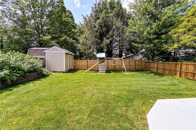 25 Nottingham Dr, Hempfield Twp, PA 15601 - fenced backyard with a playground and a storage unit