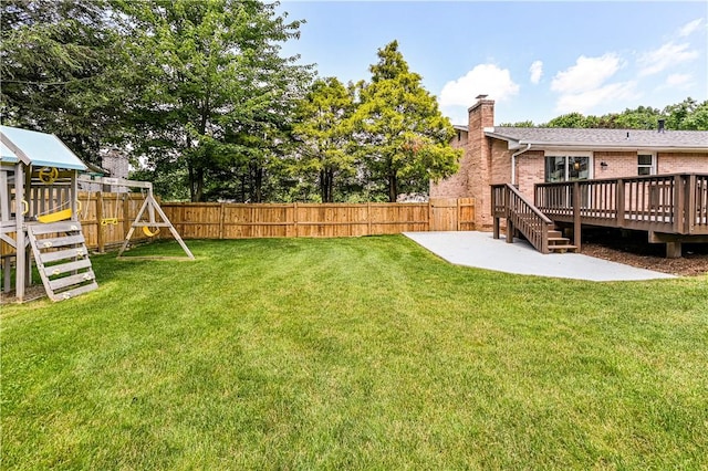 25 Nottingham Dr, Hempfield Twp, PA 15601 - fenced backyard featuring a playground, a patio area, and a deck
