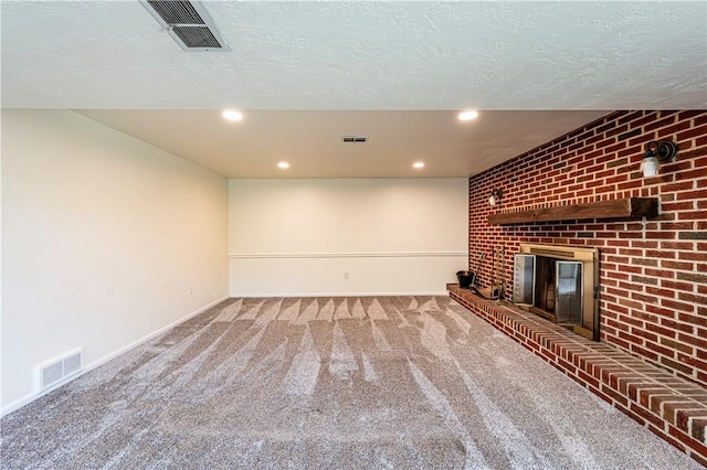 25 Nottingham Dr, Hempfield Twp, PA 15601 - unfurnished living room with carpet flooring, a brick fireplace, recessed lighting, and a textured ceiling