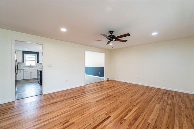 25 Nottingham Dr, Hempfield Twp, PA 15601 - unfurnished room featuring light wood-style floors, a ceiling fan, and recessed lighting