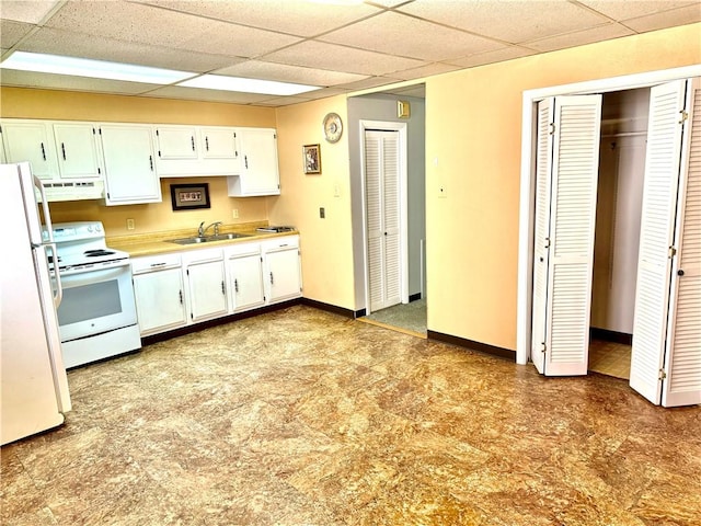 314-316 W Main St, Monongahela, PA 15063 - kitchen with white appliances, under cabinet range hood, a drop ceiling, white cabinets, and light countertops