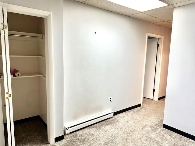 314-316 W Main St, Monongahela, PA 15063 - carpeted empty room with a baseboard heating unit and a drop ceiling