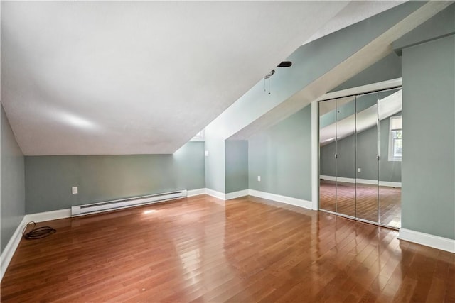 2617-2619 Spring Garden Ave, Spring Garden, PA 15212 - bonus room featuring a baseboard heating unit, vaulted ceiling, and wood finished floors