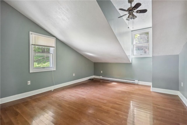 2617-2619 Spring Garden Ave, Spring Garden, PA 15212 - bonus room featuring a baseboard radiator, vaulted ceiling, wood finished floors, ceiling fan, and a textured ceiling