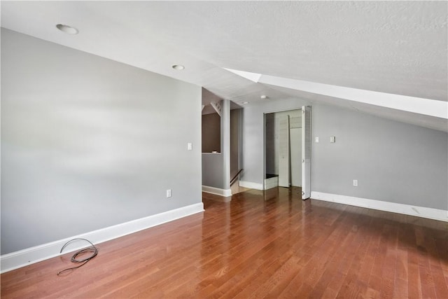 2617-2619 Spring Garden Ave, Spring Garden, PA 15212 - spare room with a skylight, lofted ceiling, wood finished floors, and recessed lighting
