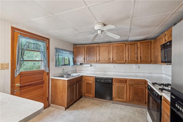 2617-2619 Spring Garden Ave, Spring Garden, PA 15212 - kitchen featuring black appliances, a drop ceiling, brown cabinetry, light countertops, and ceiling fan