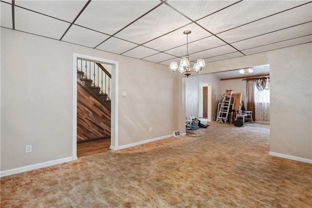 2617-2619 Spring Garden Ave, Spring Garden, PA 15212 - carpeted empty room with a paneled ceiling, stairway, and a chandelier